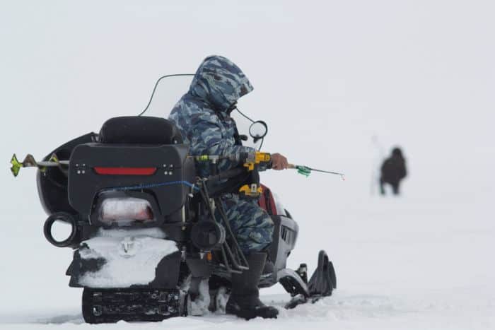 Handling A Snowmobile Ice Fishing